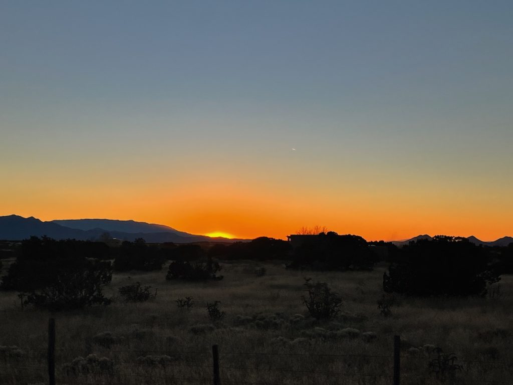 The sun dawns over a mountain desertscape