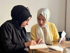 A picture of two women of the Knitting For Hope program